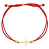 Bransoletka złoty krzyżyk z cyrkoniami na czerwonym sznurku