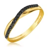 Złoty pierścionek z czarnymi kamieniami