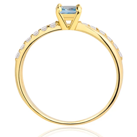 Złoty pierścionek zaręczynowy błękitny kamień
