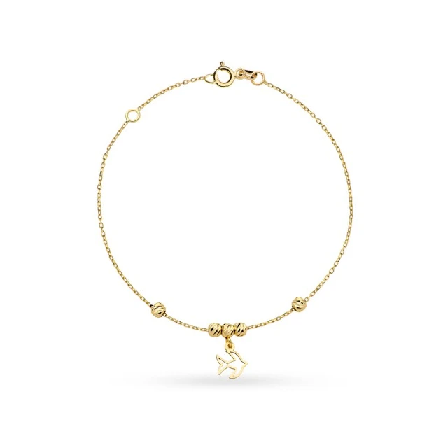 Goldenes Schwalbenarmband und goldene Diamantkugeln