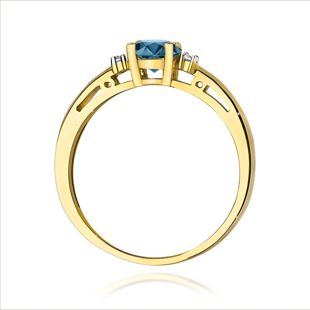 Złoty pierścionek z topazem London Blue 0,50 ct i diamentami 375
