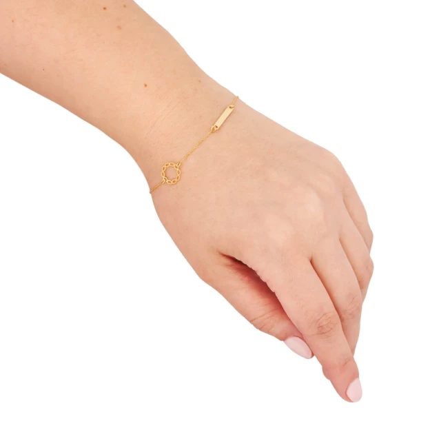 Goldenes Armband mit Plakette und Kranz